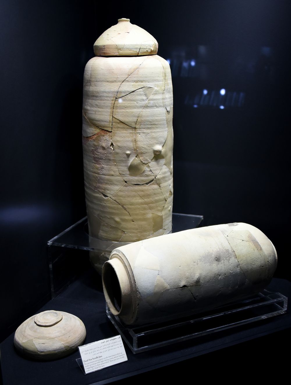Two cylindrical clay jars with a lid, of the type that held scrolls