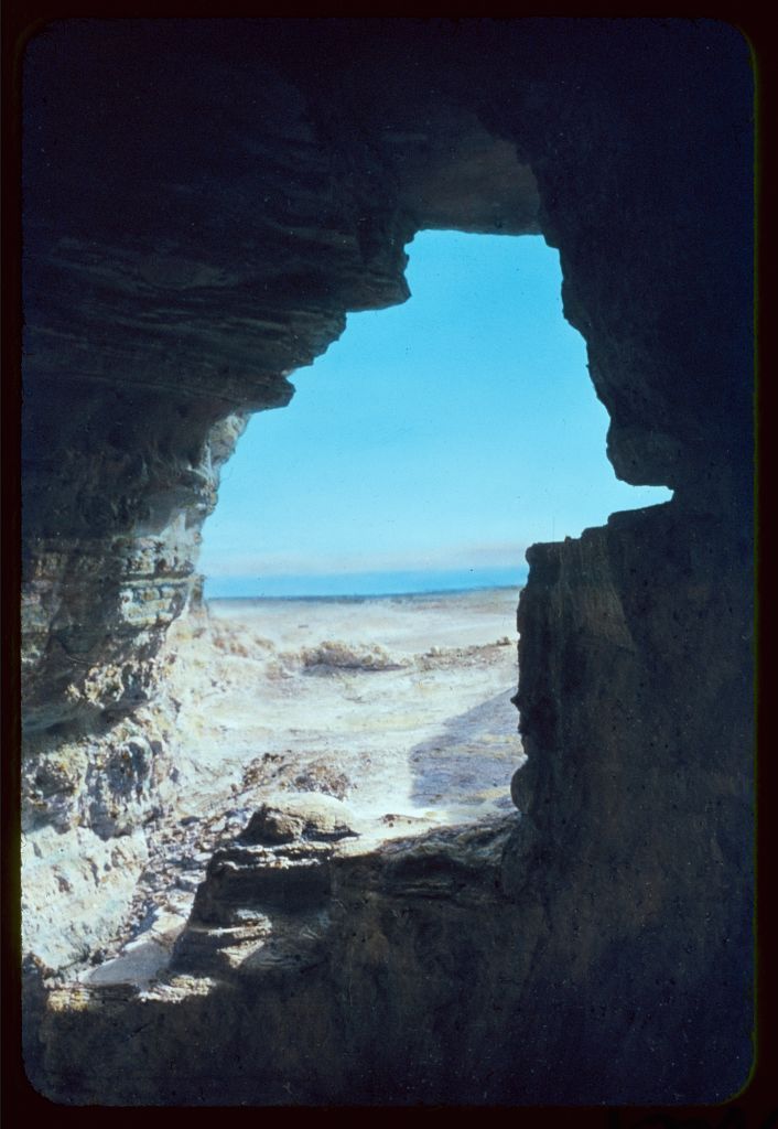 The Dead Sea framed by the opening of a cave