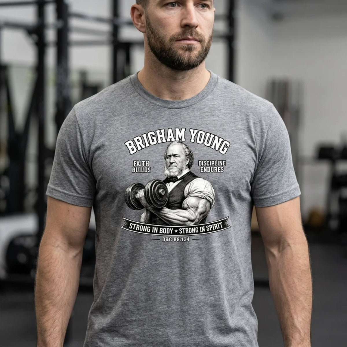 Man wearing a Brigham Young strong in body strong in spirit LDS t-shirt in a gym